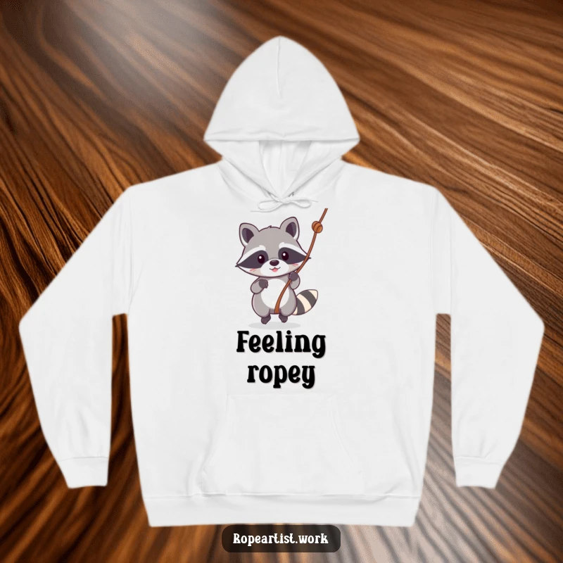 Funny Kawaii Raccoon Hoodie showing a cute raccoon swinging with joy, perfect for cold weather and cartoon lovers seeking humor.