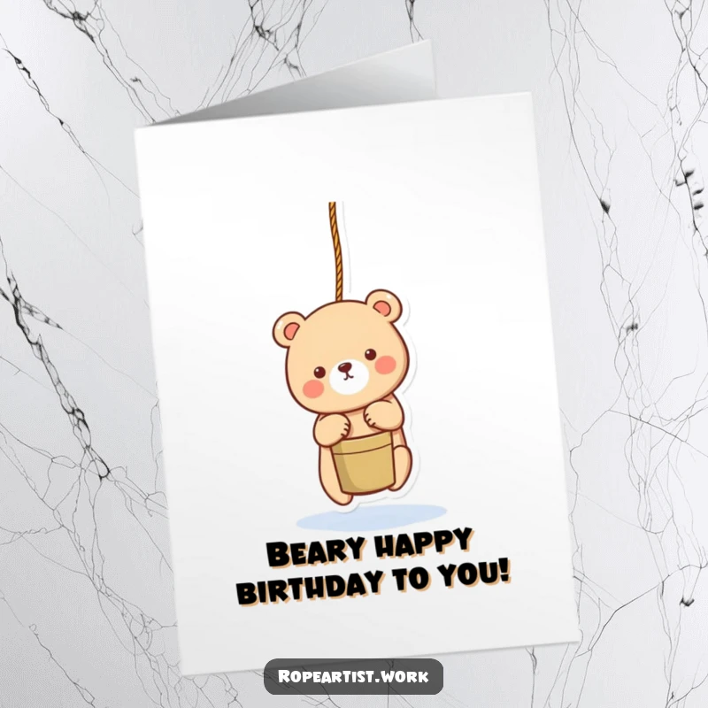 Funny Free Printable Birthday Card: An adorable bear character lowering a bucket with a rope, ready to deliver birthday cheer.